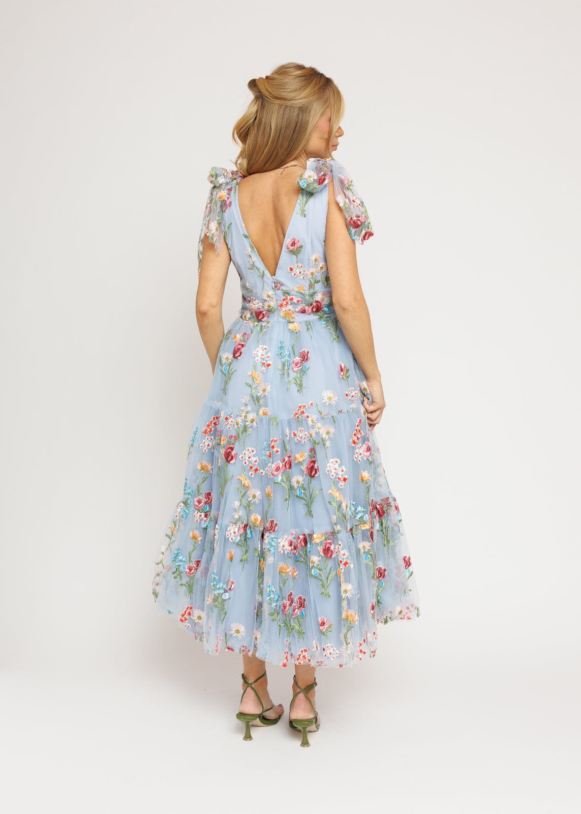 chic size inclusive model wearing JessaKae Margaret Floral Midi Dress Blue Dresses