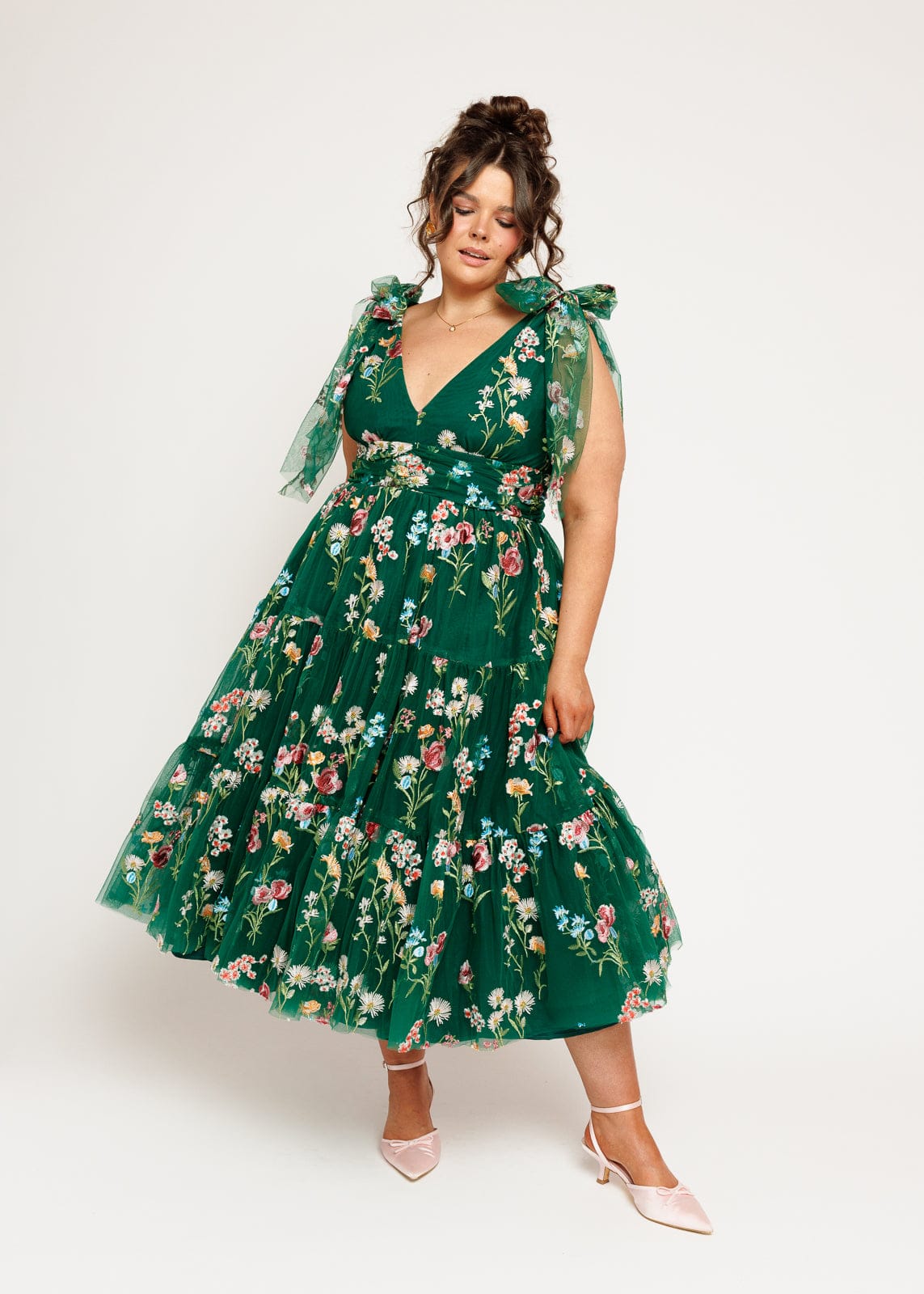 chic size inclusive model wearing JessaKae Margaret Floral Midi Dress Emerald Dresses