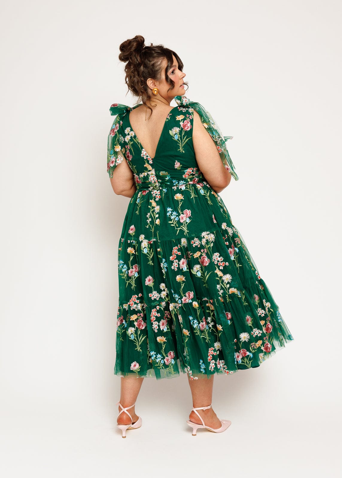 chic size inclusive model wearing JessaKae Margaret Floral Midi Dress Emerald Dresses