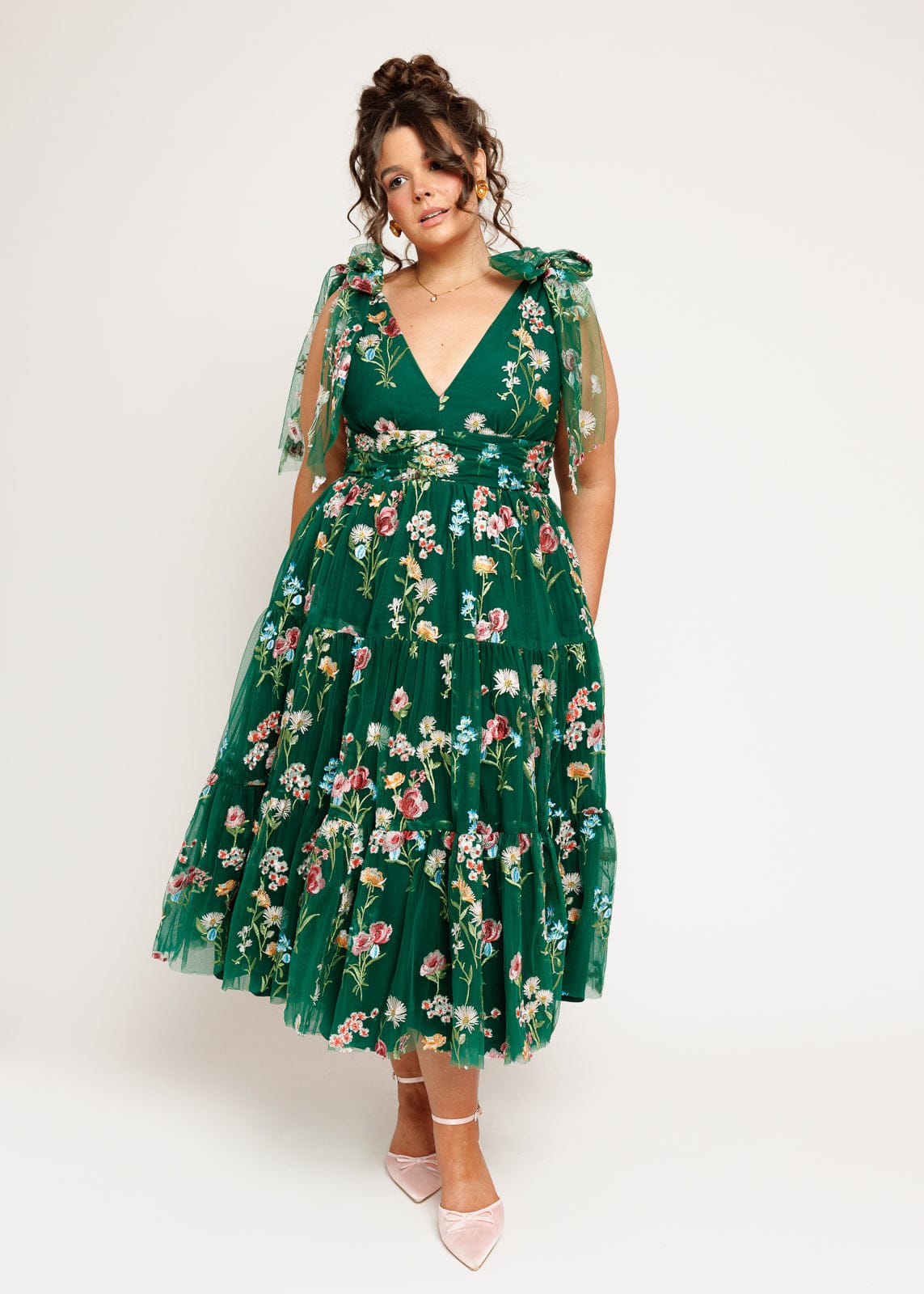 chic size inclusive model wearing JessaKae Margaret Floral Midi Dress Emerald Dresses