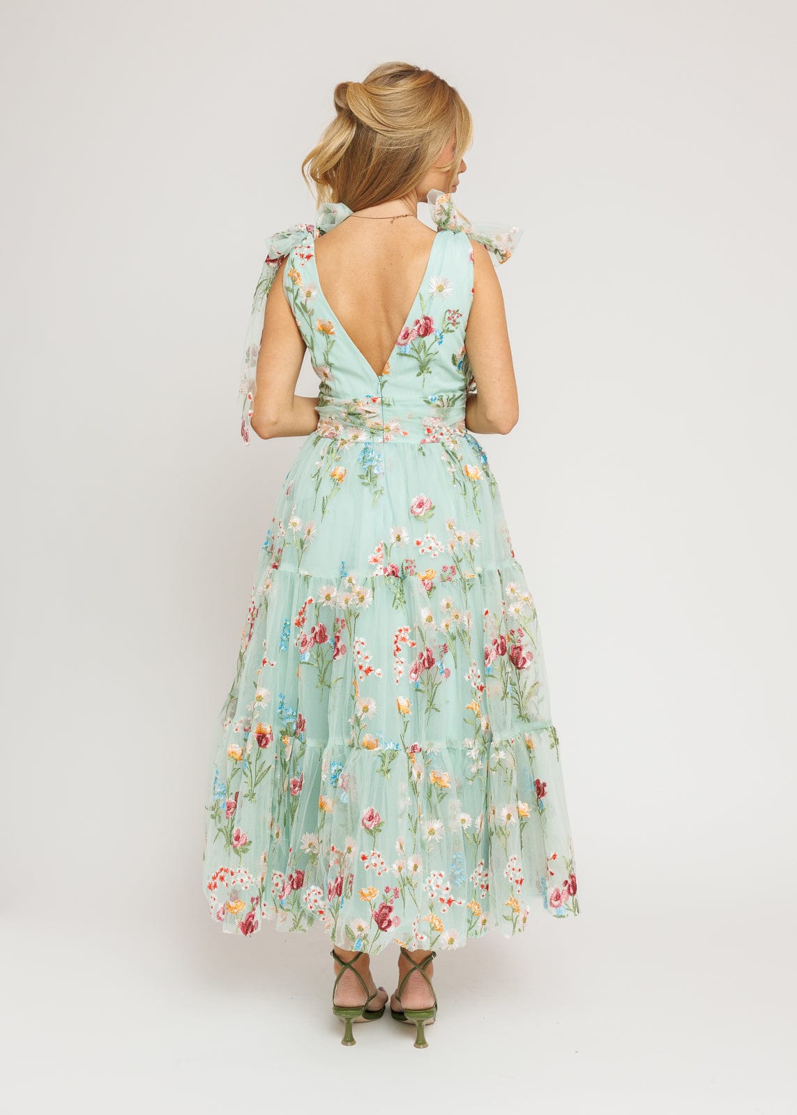 chic size inclusive model wearing JessaKae Margaret Floral Midi Dress Green Dresses