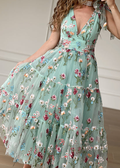 chic size inclusive model wearing JessaKae Margaret Floral Midi Dress Green Dresses