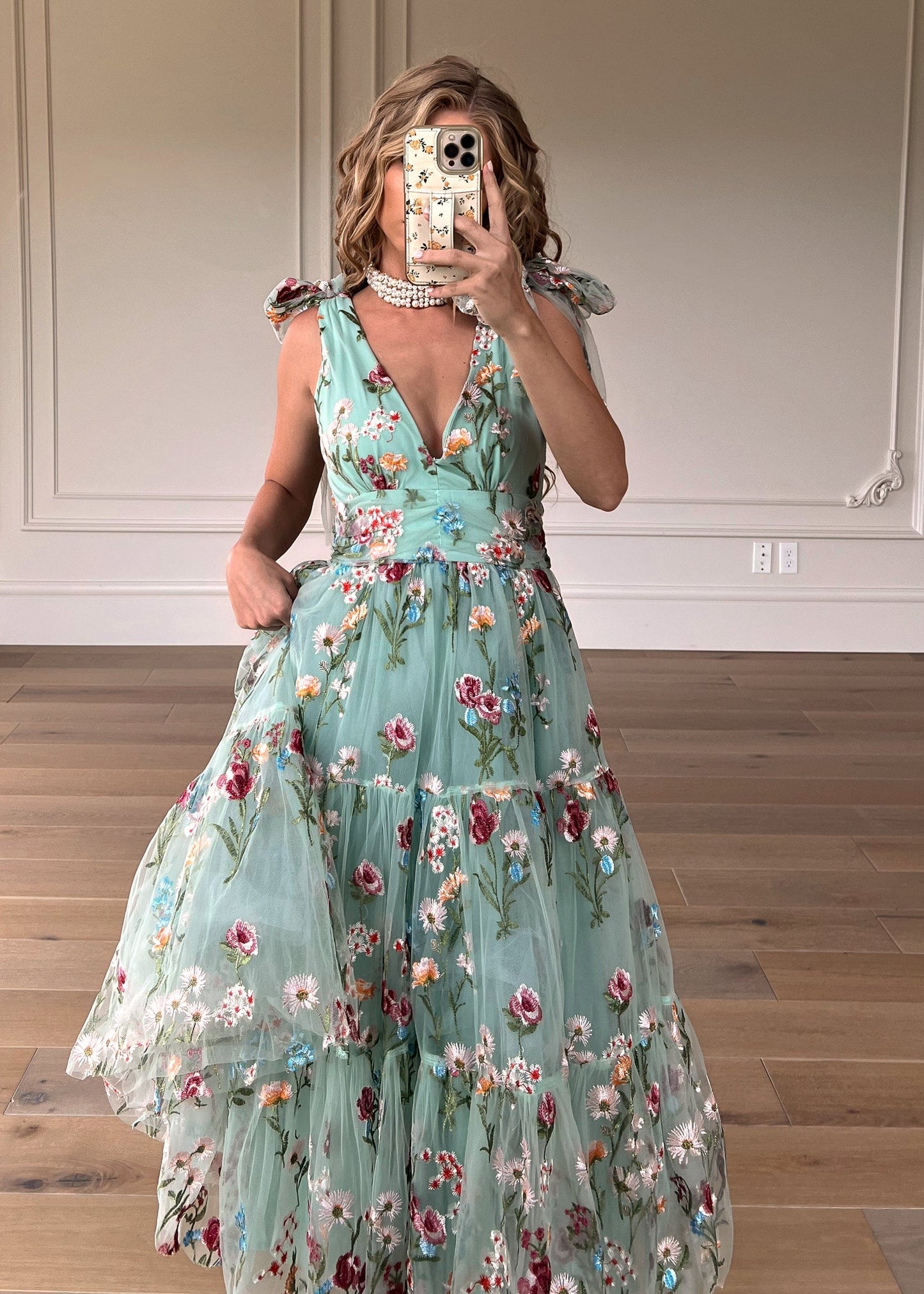 chic size inclusive model wearing JessaKae Margaret Floral Midi Dress Green Dresses