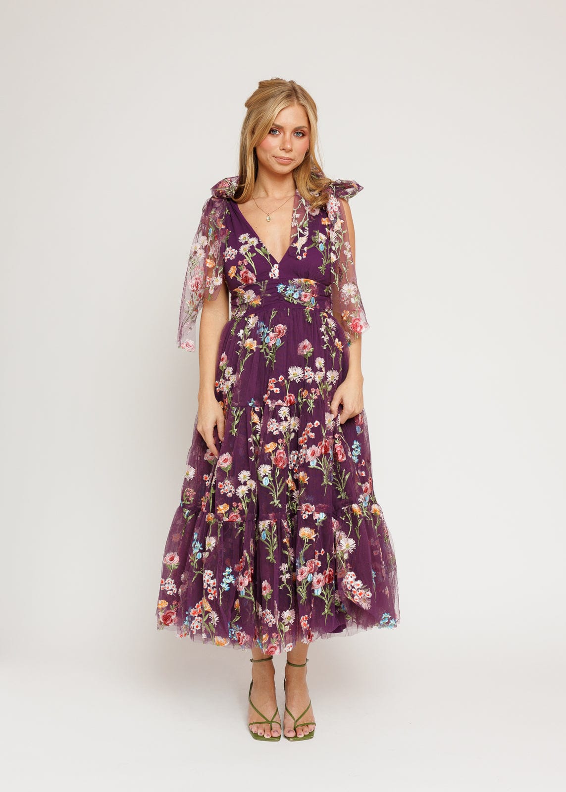 chic size inclusive model wearing JessaKae Margaret Floral Midi Dress Purple Dresses