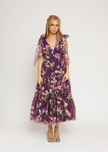 chic size inclusive model wearing JessaKae Margaret Floral Midi Dress Purple Dresses