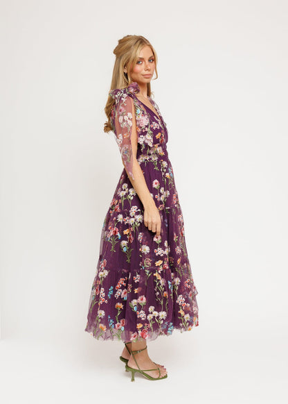 chic size inclusive model wearing JessaKae Margaret Floral Midi Dress Purple Dresses