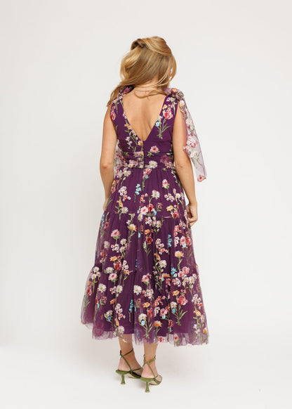 chic size inclusive model wearing JessaKae Margaret Floral Midi Dress Purple Dresses