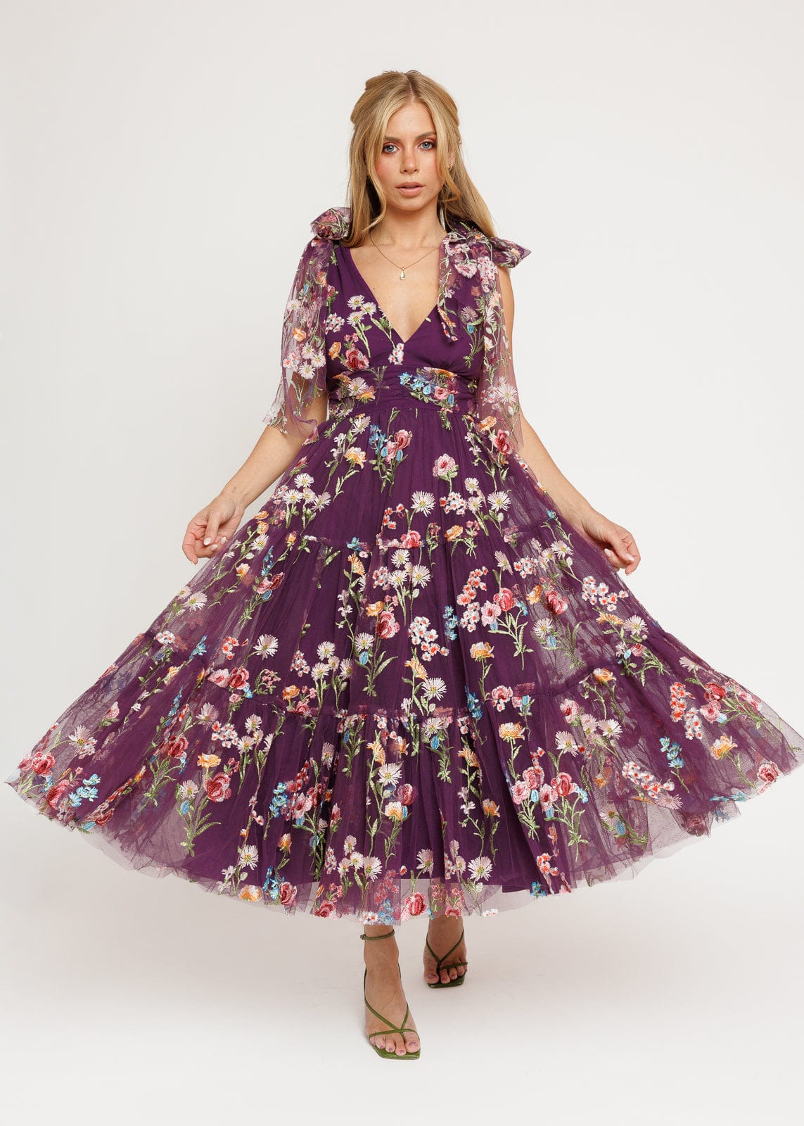 chic size inclusive model wearing JessaKae Margaret Floral Midi Dress Purple Dresses