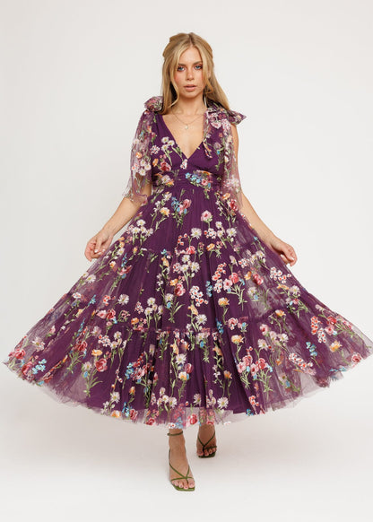 chic size inclusive model wearing JessaKae Margaret Floral Midi Dress Purple Dresses