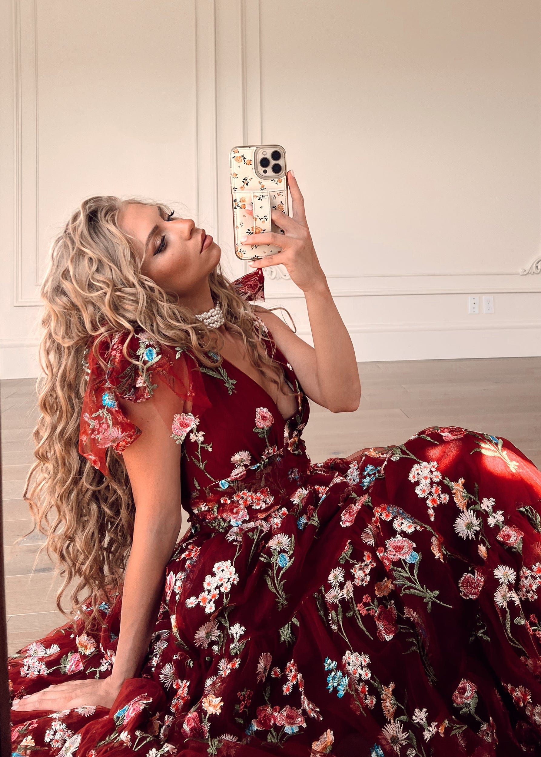 chic size inclusive model wearing JessaKae Margaret Floral Midi Dress Red Dresses