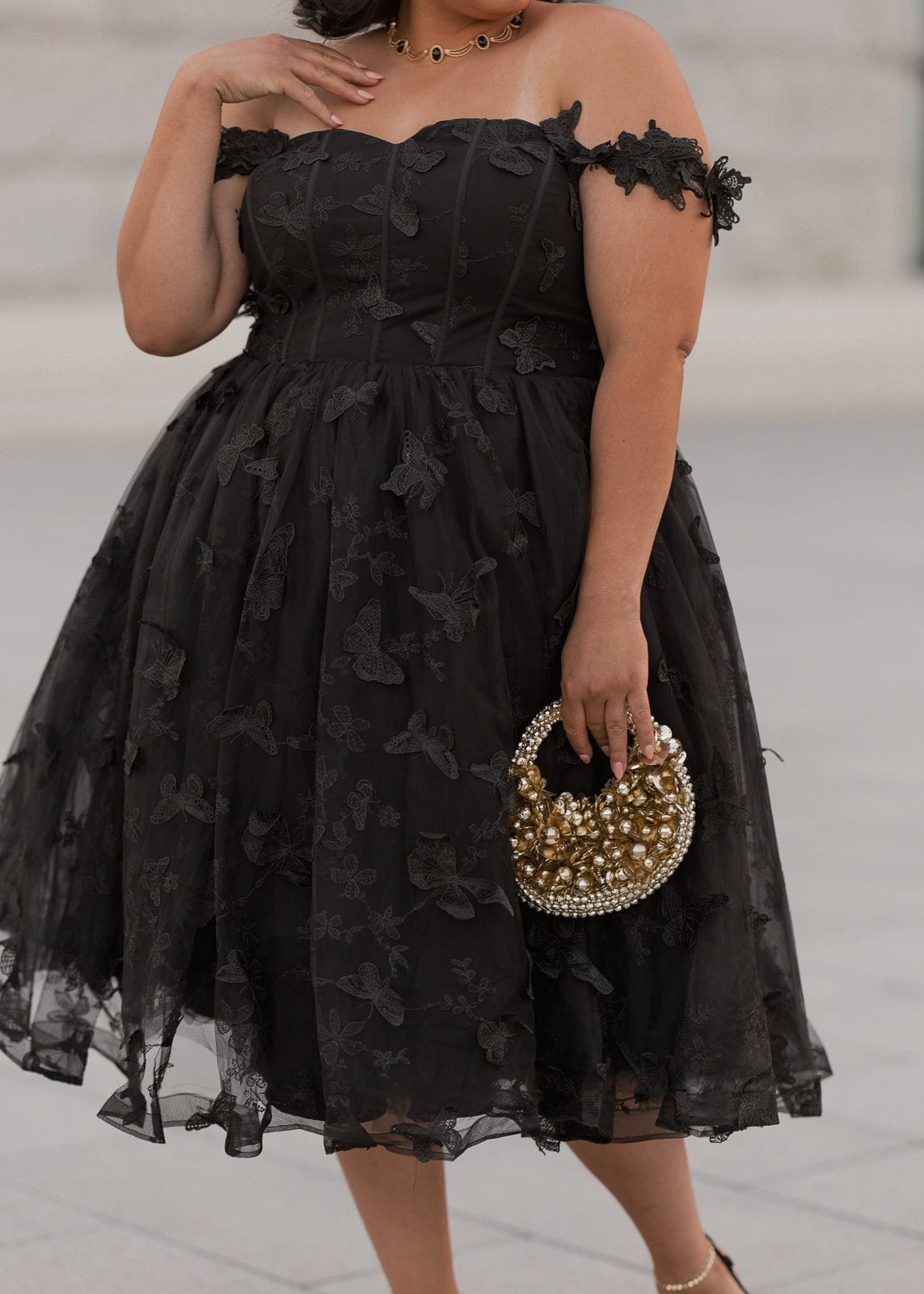 chic size inclusive model wearing JessaKae Mariposa Dress