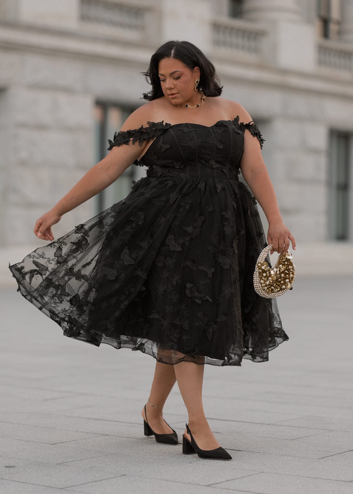 chic size inclusive model wearing JessaKae Mariposa Dress
