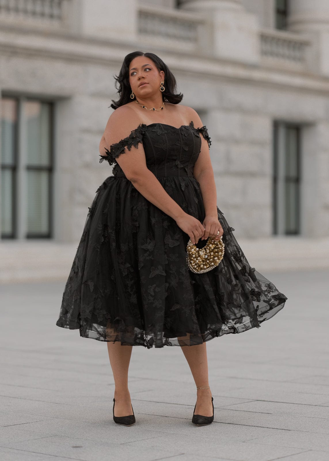 chic size inclusive model wearing JessaKae Mariposa Dress