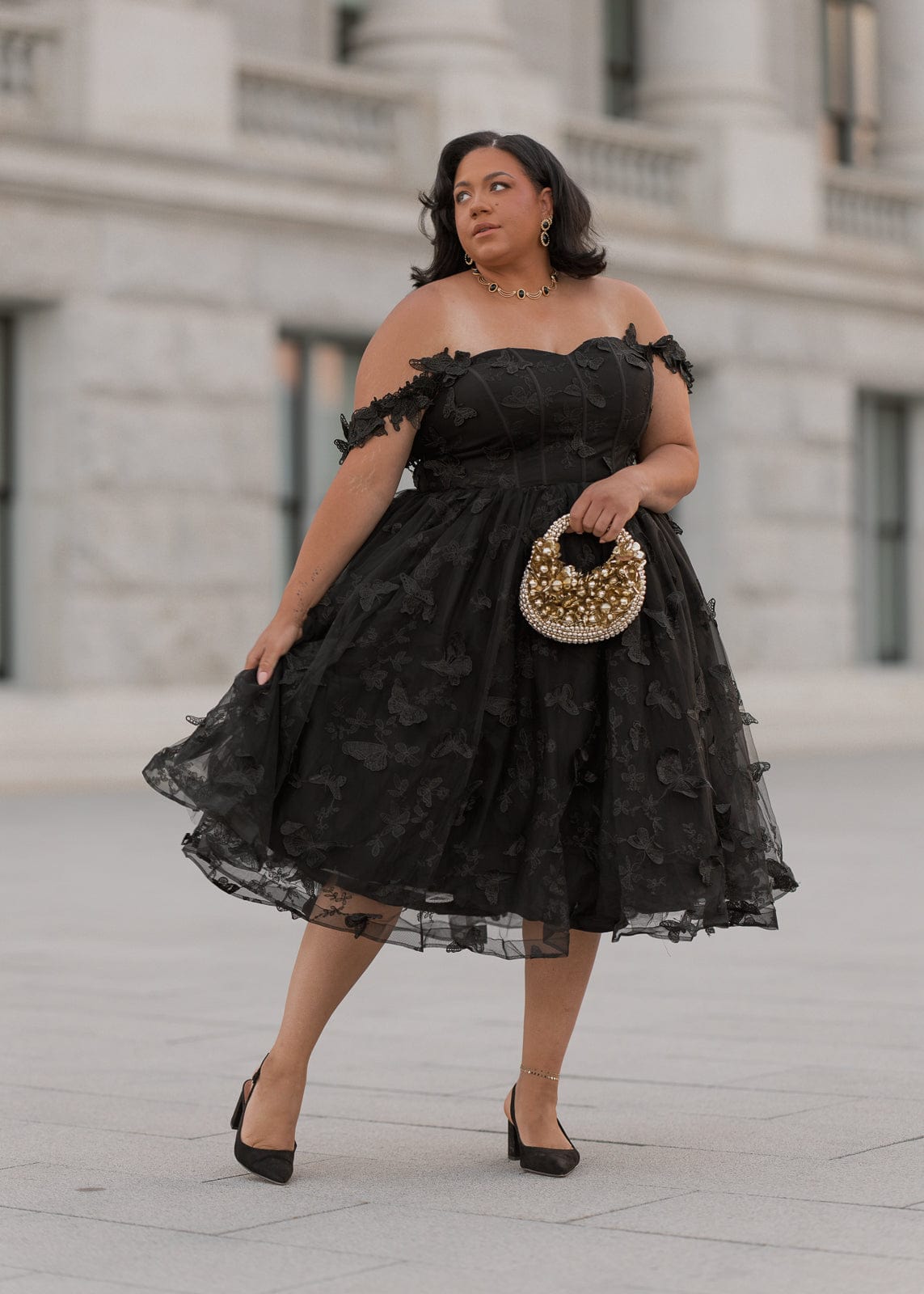 chic size inclusive model wearing JessaKae Mariposa Dress