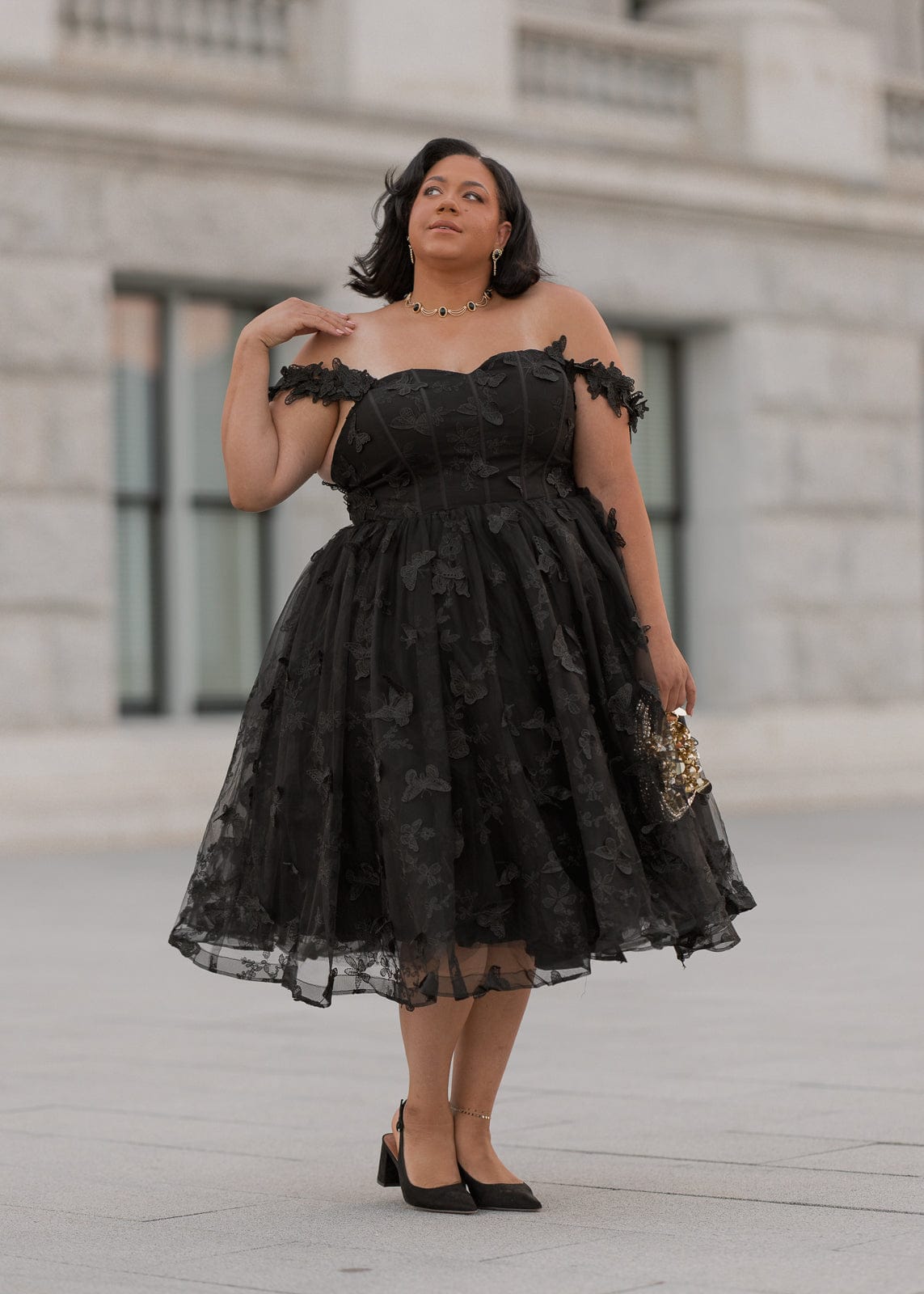 chic size inclusive model wearing JessaKae Mariposa Dress