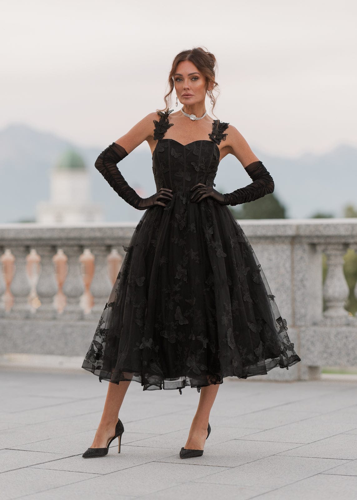 chic size inclusive model wearing JessaKae Mariposa Dress