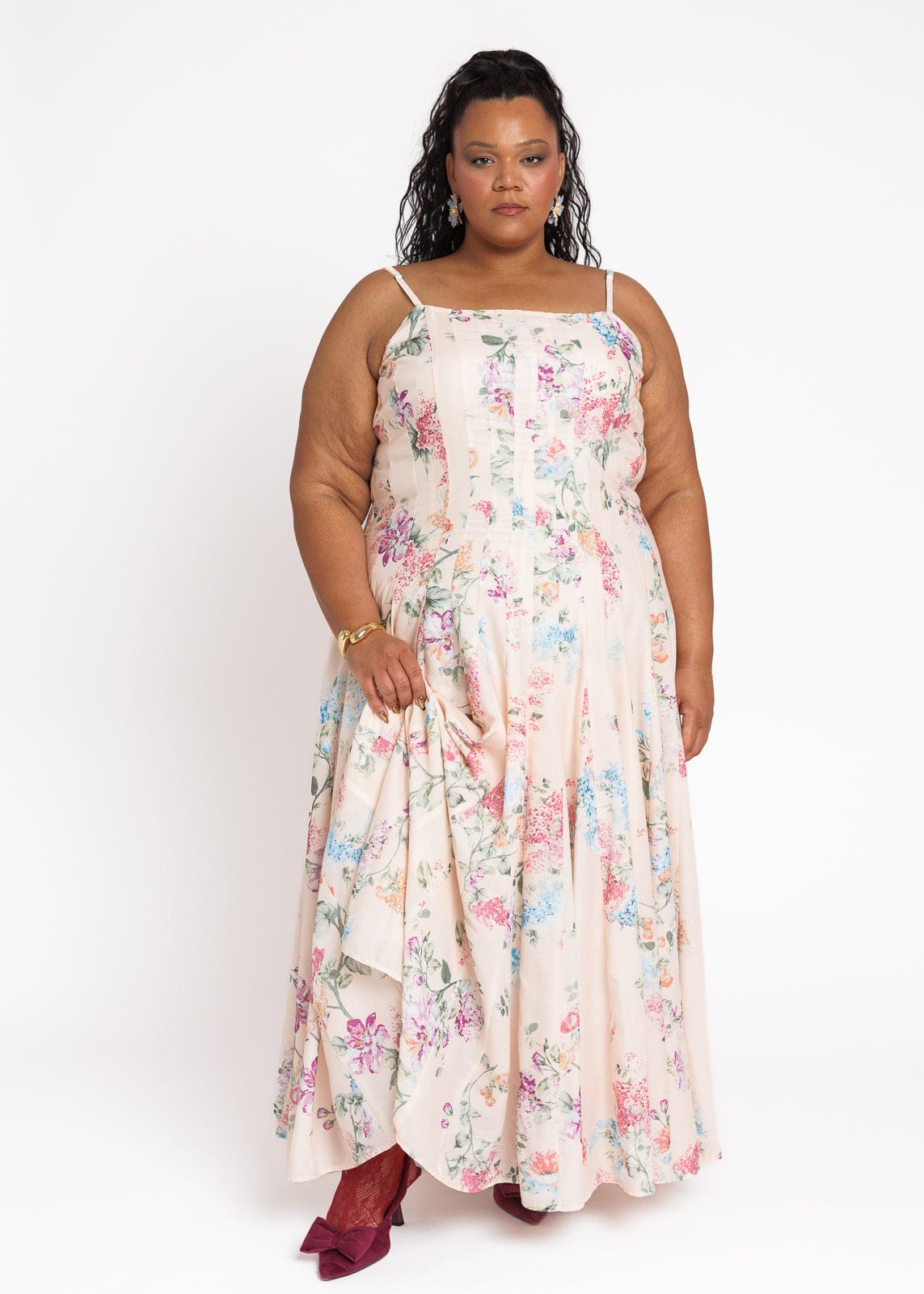 chic size inclusive model wearing JessaKae Monet Floral Seamed Maxi Dress