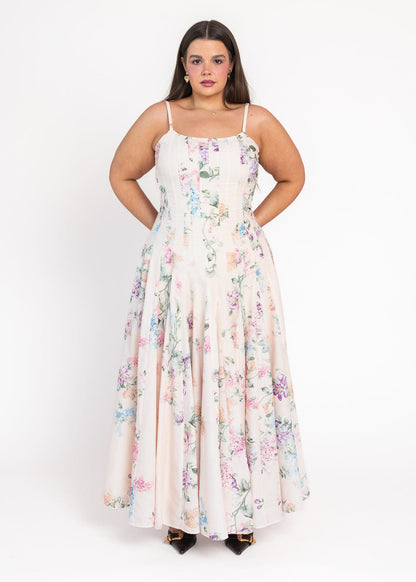 chic size inclusive model wearing JessaKae Monet Floral Seamed Maxi Dress