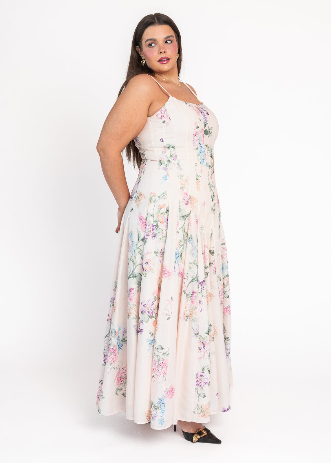 chic size inclusive model wearing JessaKae Monet Floral Seamed Maxi Dress