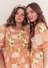 chic size inclusive model wearing JessaKae Orange Blossom Dress Dresses