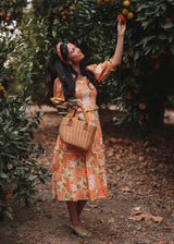 chic size inclusive model wearing JessaKae Orange Blossom Dress Orange / XXS Dresses