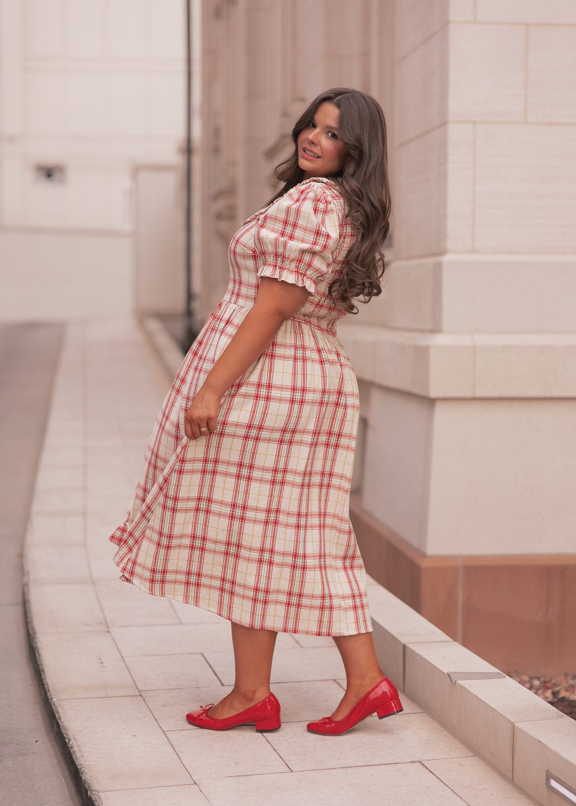 chic size inclusive model wearing JessaKae Pyper Dress