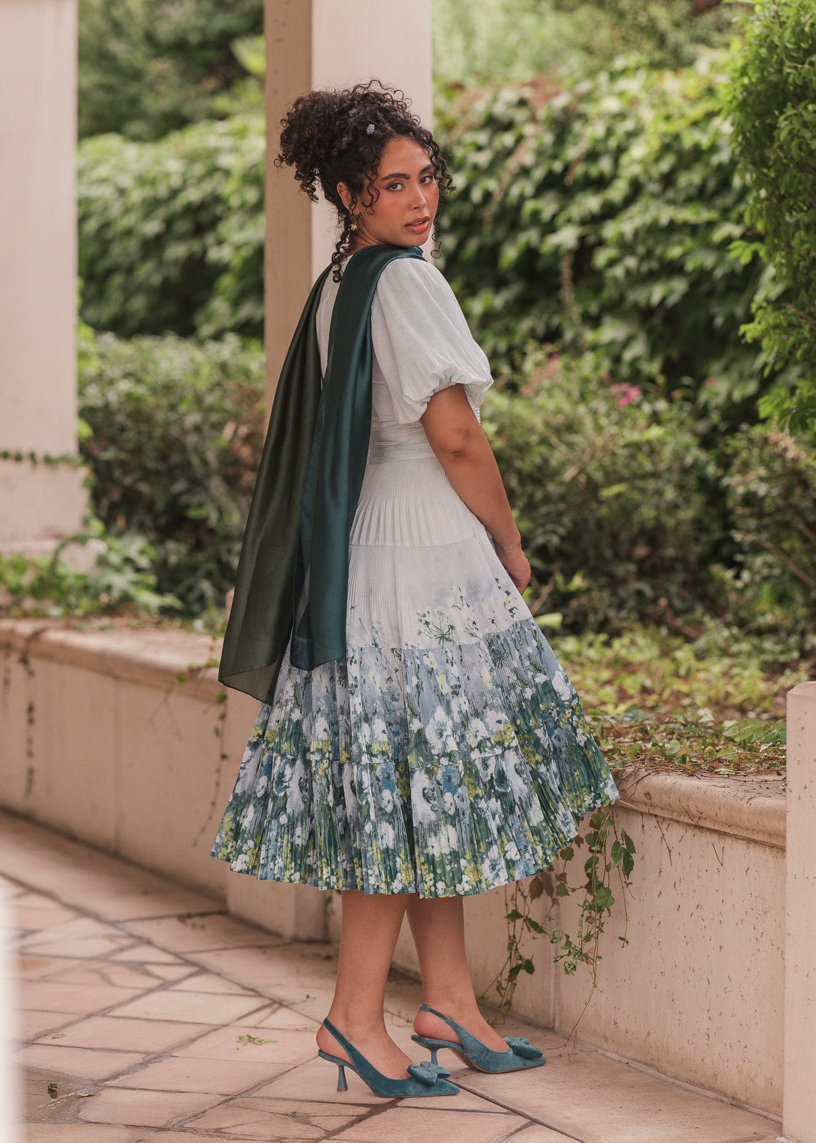 chic size inclusive model wearing JessaKae Renoir Dress