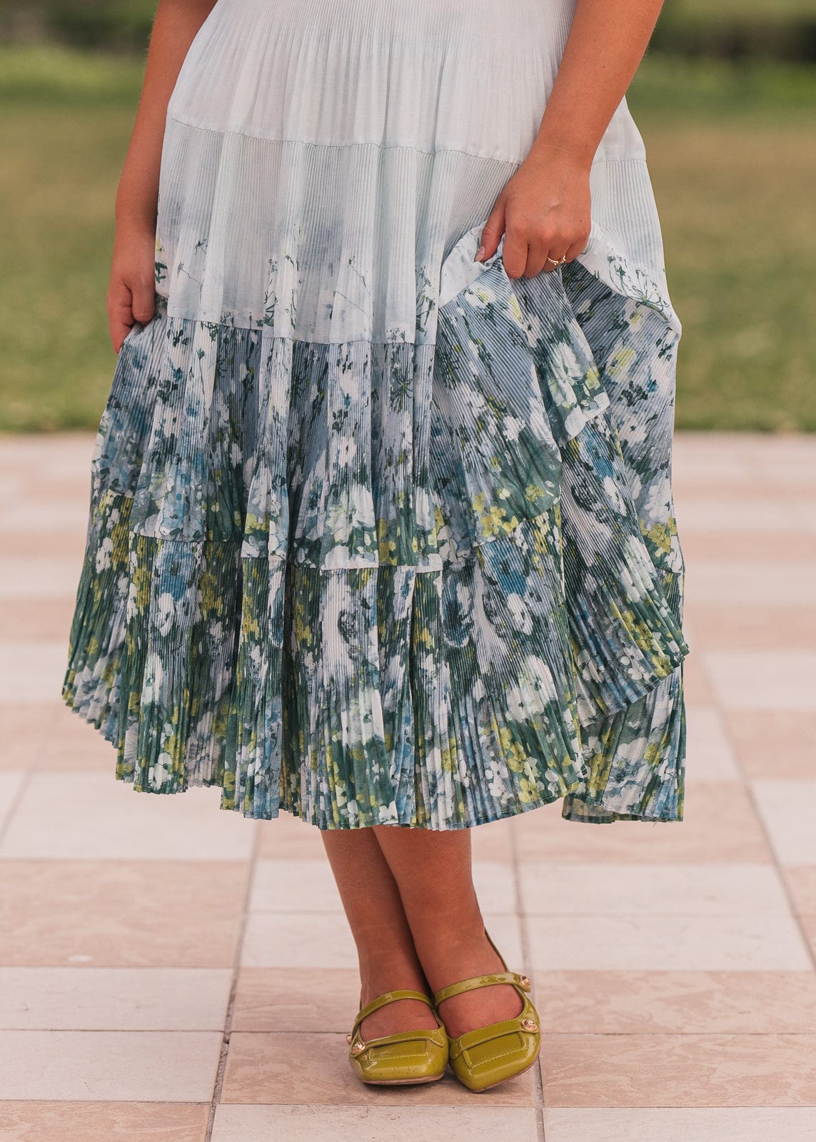 chic size inclusive model wearing JessaKae Renoir Dress