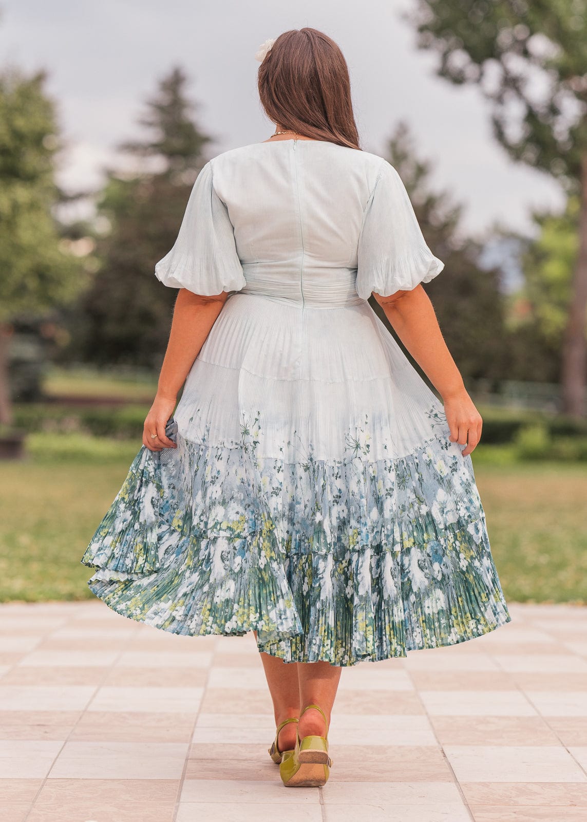 chic size inclusive model wearing JessaKae Renoir Dress