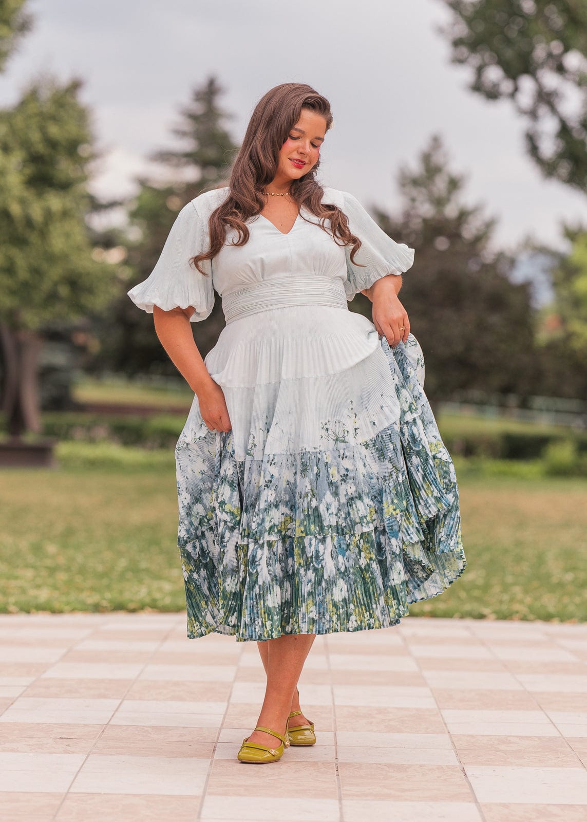 chic size inclusive model wearing JessaKae Renoir Dress
