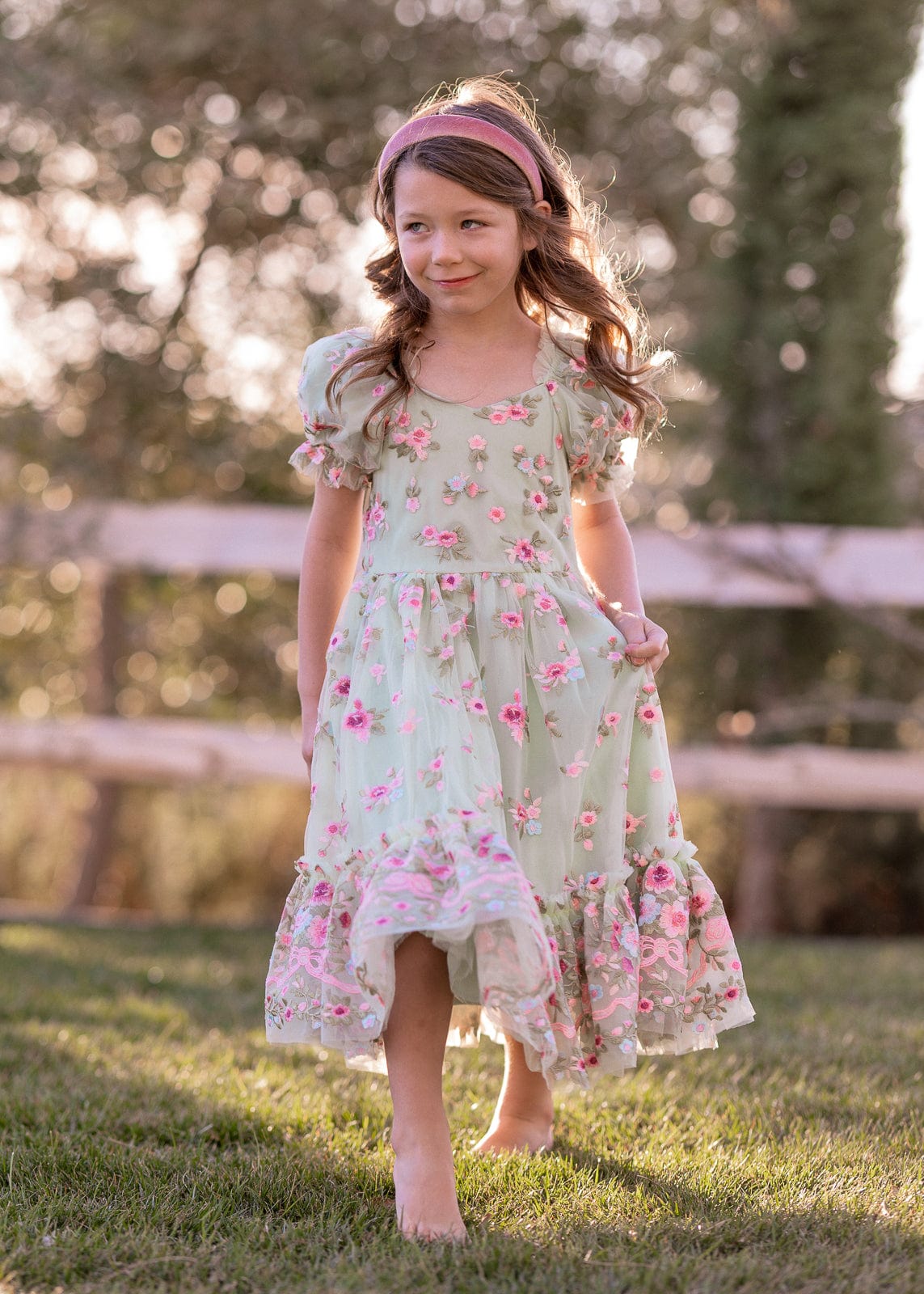 chic size inclusive model wearing JessaKae Rosalie Girls Dress