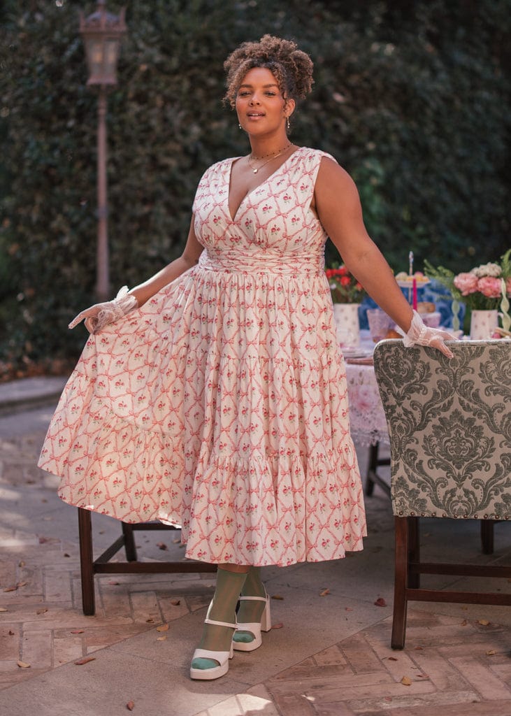 chic size inclusive model wearing JessaKae Rosebud Dress