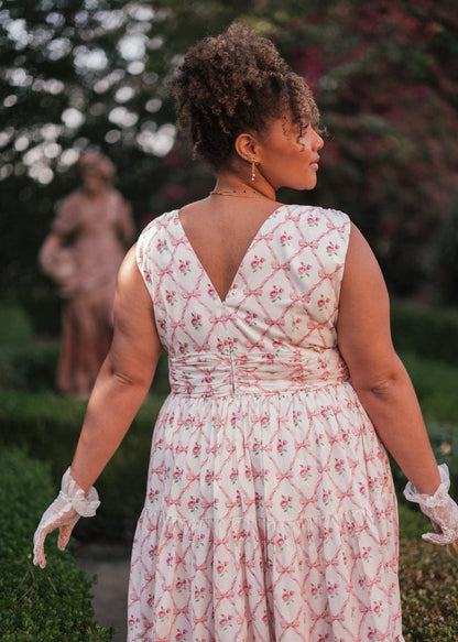 chic size inclusive model wearing JessaKae Rosebud Dress