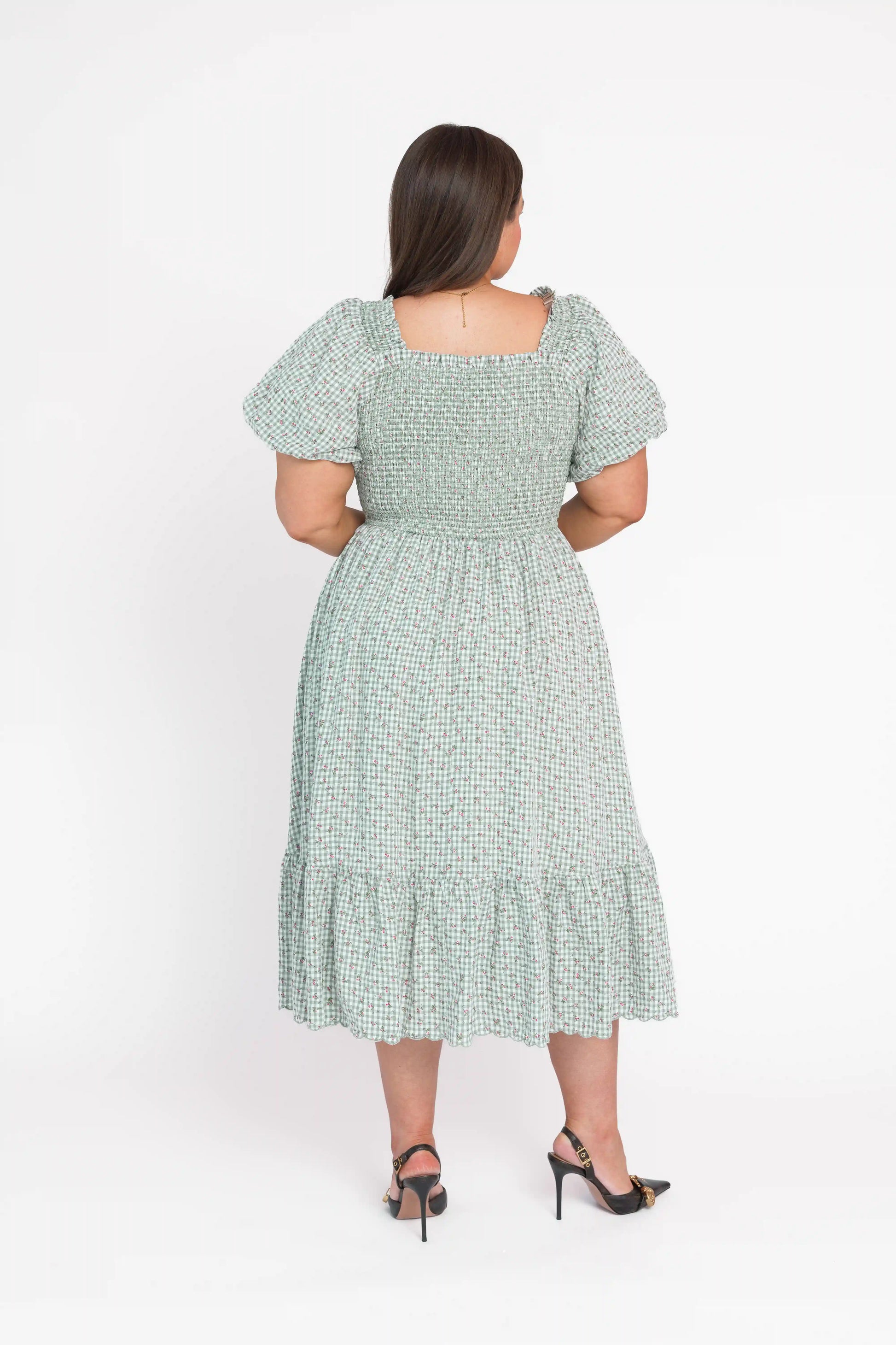 chic size inclusive model wearing JessaKae Rosie Posie Dress Dresses