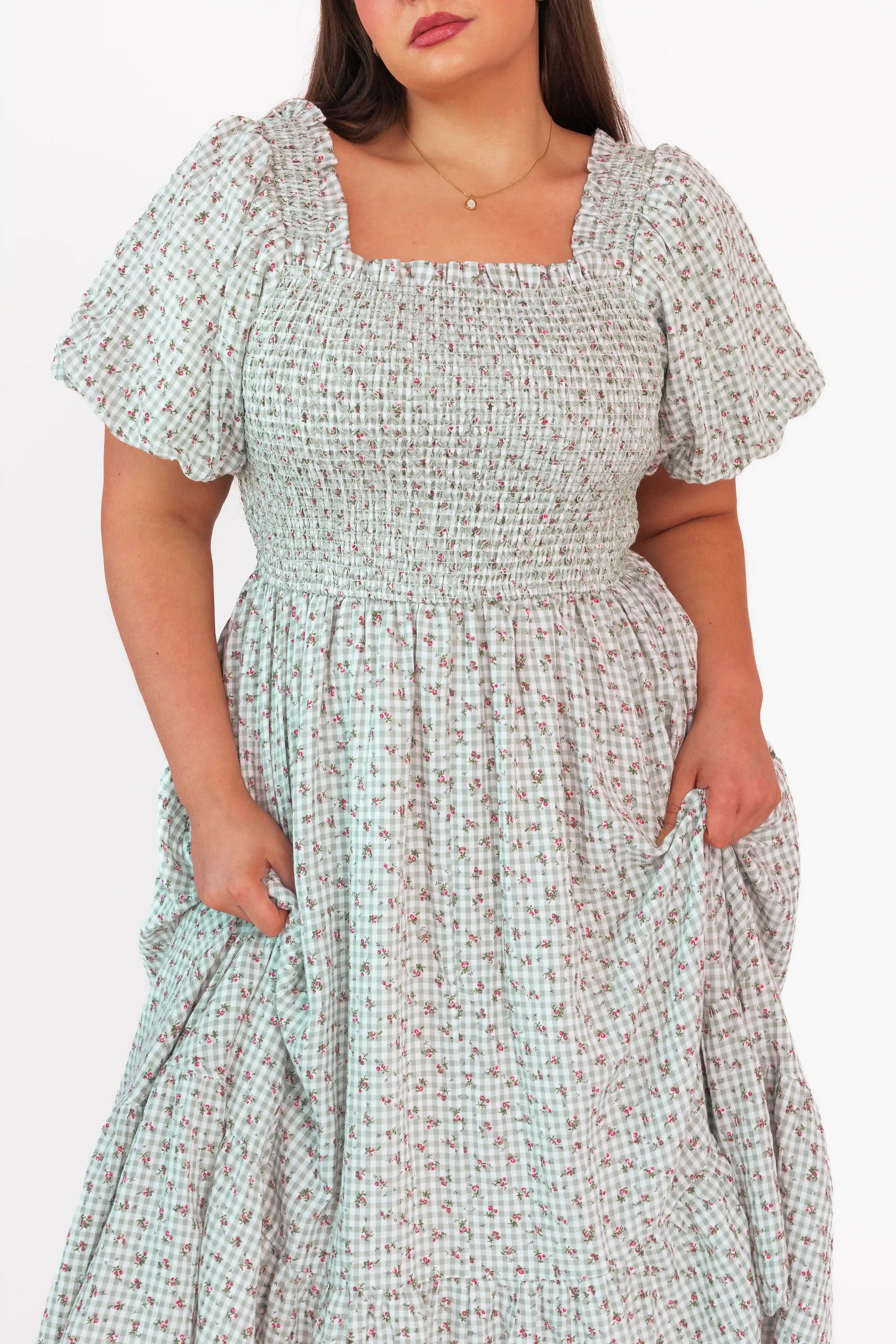 chic size inclusive model wearing JessaKae Rosie Posie Dress Dresses