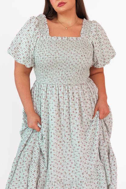 chic size inclusive model wearing JessaKae Rosie Posie Dress Dresses