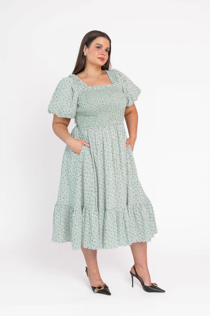 chic size inclusive model wearing JessaKae Rosie Posie Dress Dresses