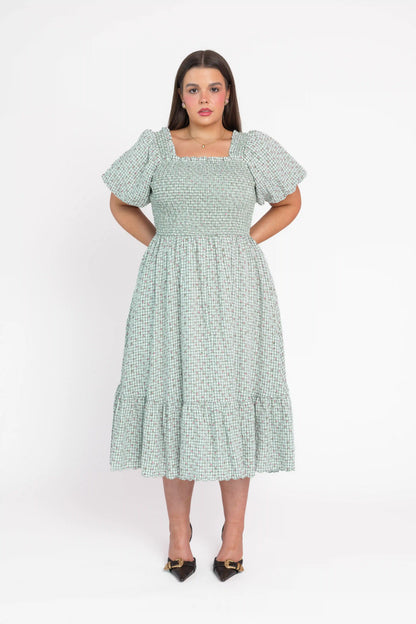 chic size inclusive model wearing JessaKae Rosie Posie Dress Dresses