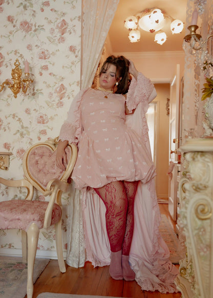 chic size inclusive model wearing JessaKae Scarlett Bubble Hem Mini Dress - Pink