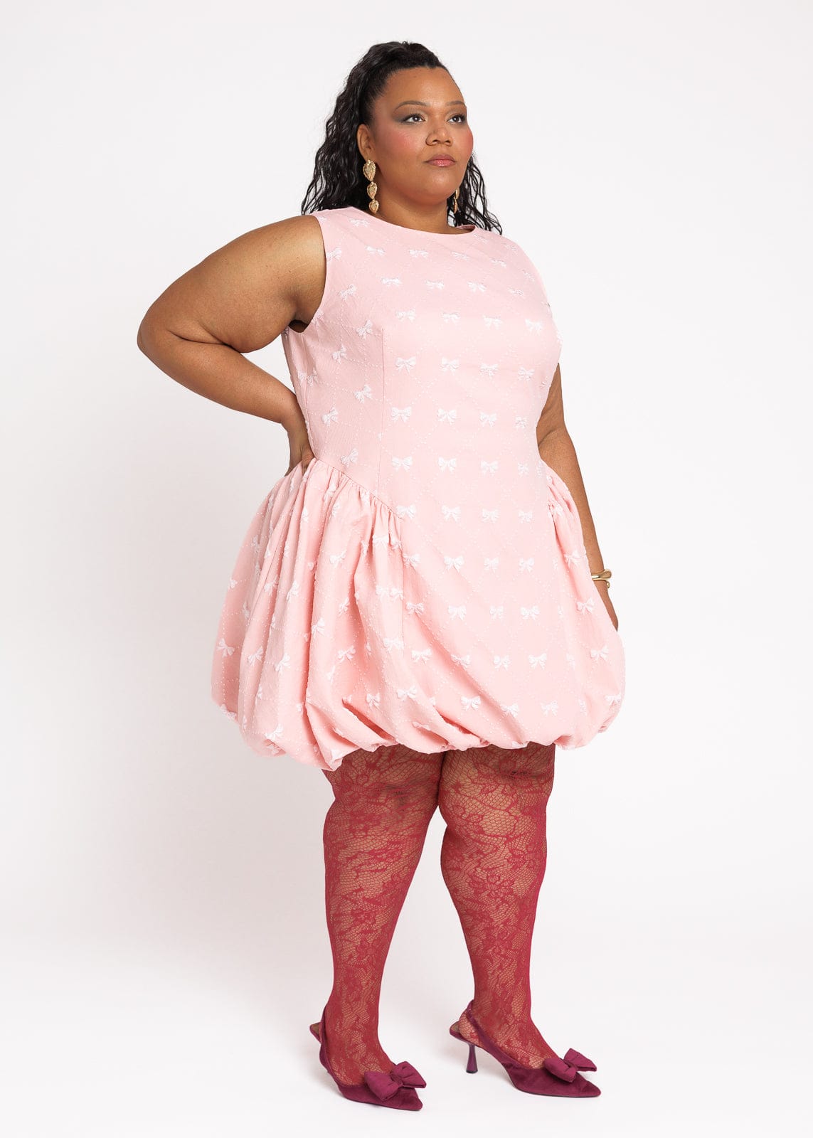 chic size inclusive model wearing JessaKae Scarlett Bubble Hem Mini Dress - Pink