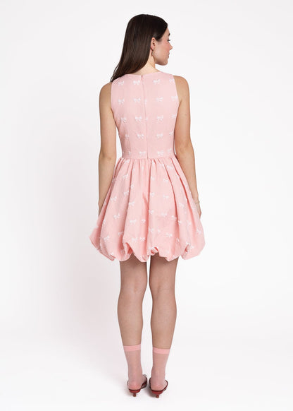 chic size inclusive model wearing JessaKae Scarlett Bubble Hem Mini Dress - Pink
