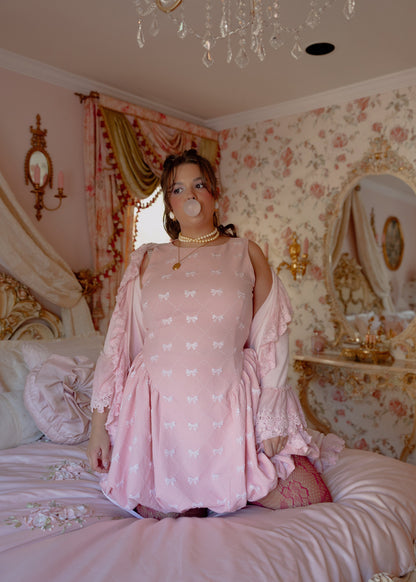 chic size inclusive model wearing JessaKae Scarlett Bubble Hem Mini Dress - Pink