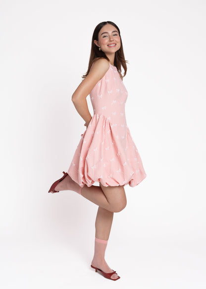 chic size inclusive model wearing JessaKae Scarlett Bubble Hem Mini Dress - Pink