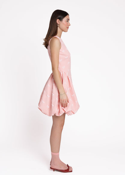 chic size inclusive model wearing JessaKae Scarlett Bubble Hem Mini Dress - Pink