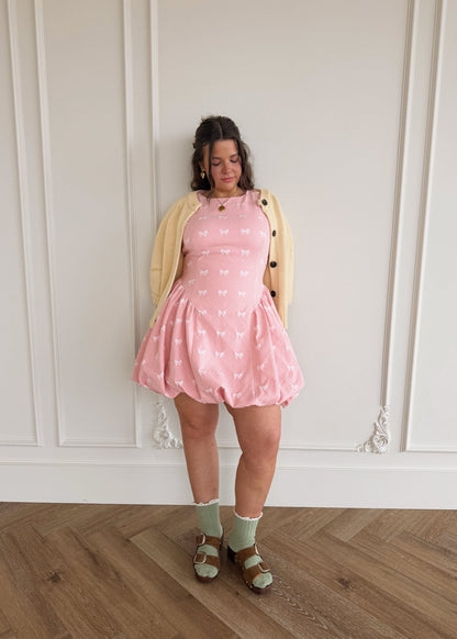 chic size inclusive model wearing JessaKae Scarlett Bubble Hem Mini Dress - Pink Dresses
