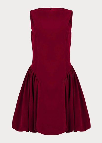 chic size inclusive model wearing JessaKae Scarlett Mini Velvet Drop Waist Dress - Red Dresses