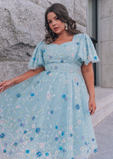 chic size inclusive model wearing JessaKae Shimmer Dress Blue / XXS Dresses