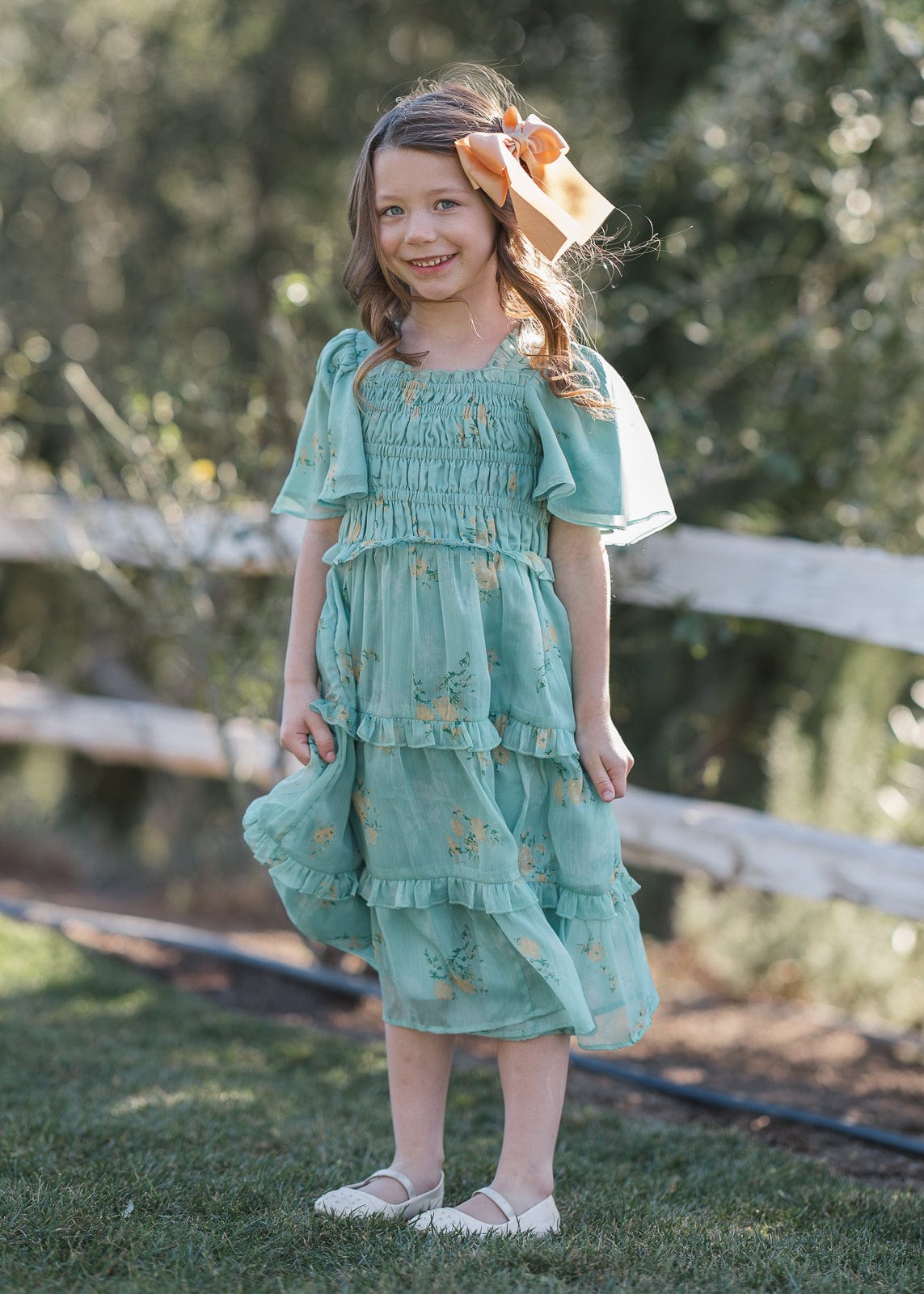 chic size inclusive model wearing JessaKae Siena Girls Dress