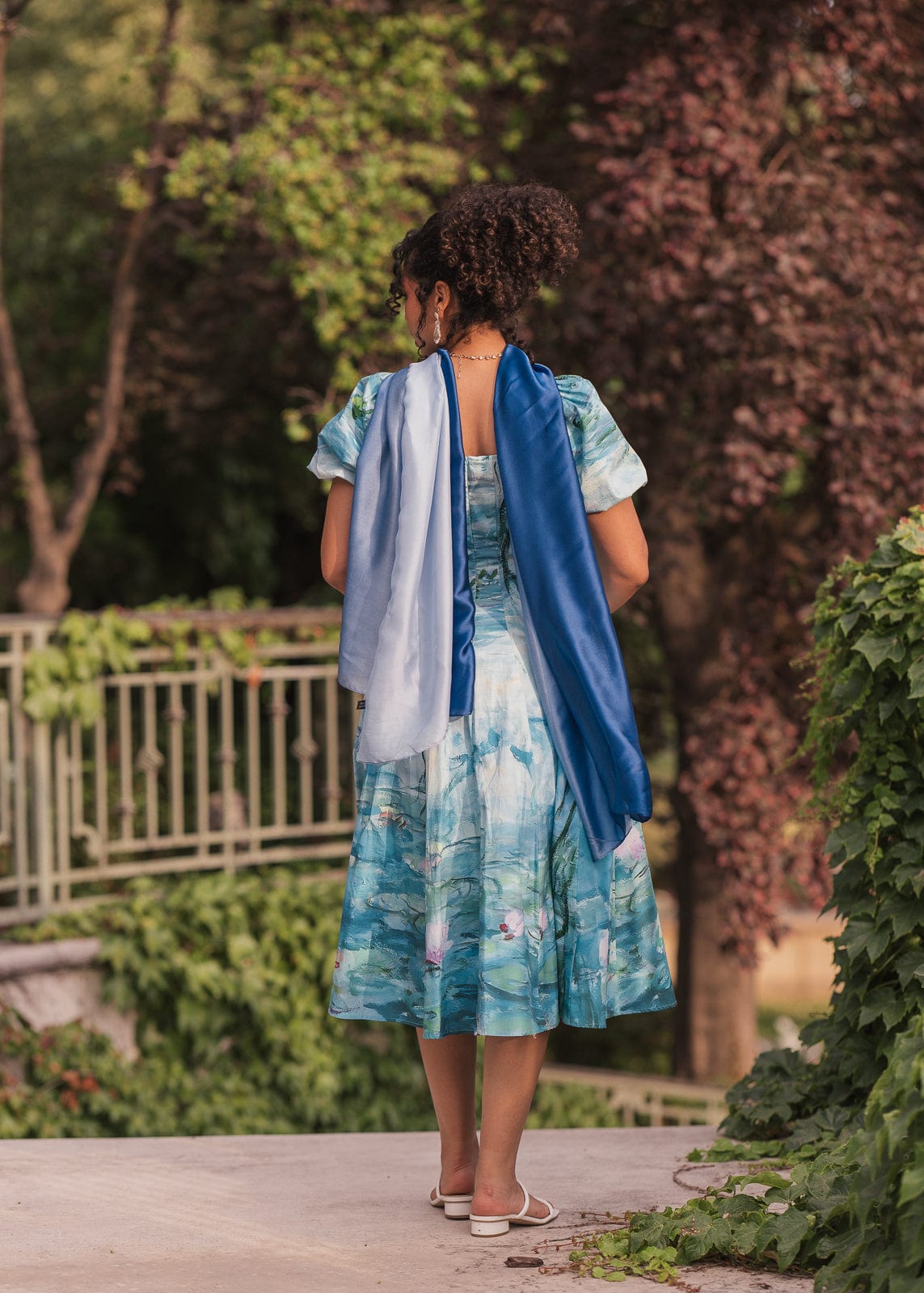 chic size inclusive model wearing JessaKae Water Lily Dress