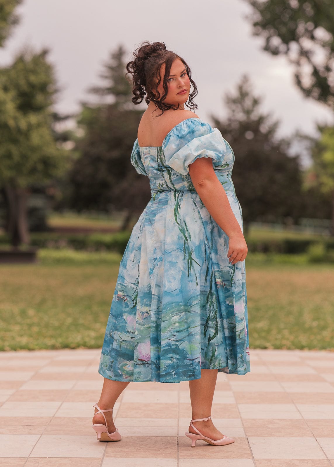 chic size inclusive model wearing JessaKae Water Lily Dress